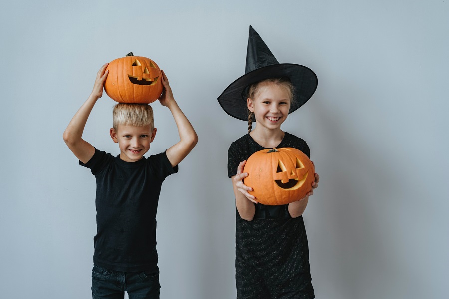 DIY Halloween Costumes  Two Kids Wearing All Black Each Holding a Jack-O-Lantern