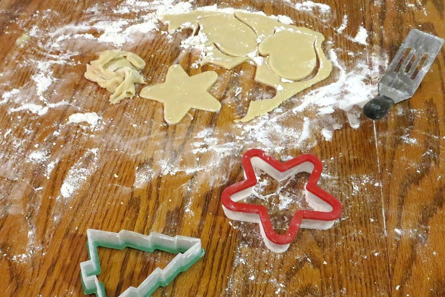 Dairy Free Holiday Cookies Close Up of Sugar Cookie Dough Rolled Out with Cookie Cutters Next to it