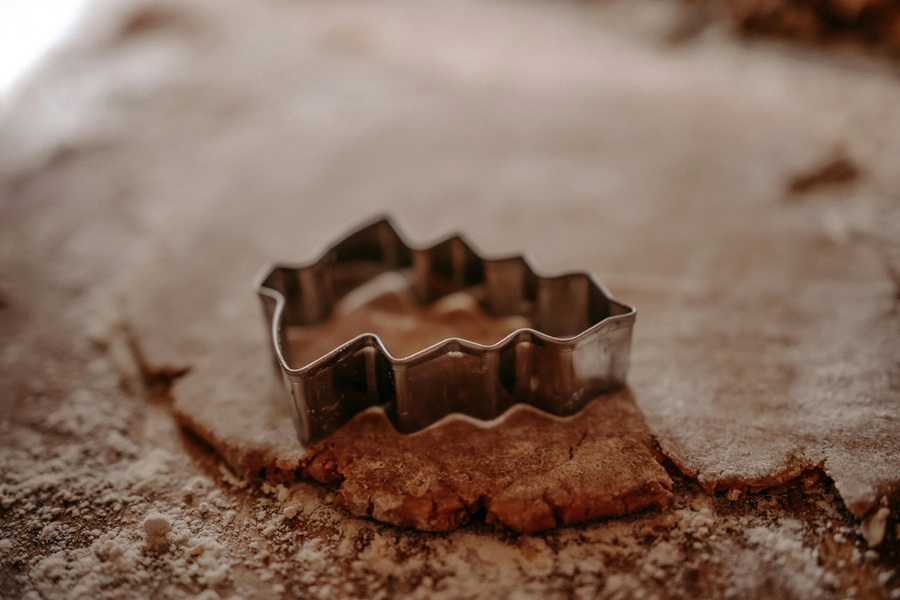 Dairy Free Holiday Cookies Close Up of a Christmas Tree Cookie Cutter on Dough