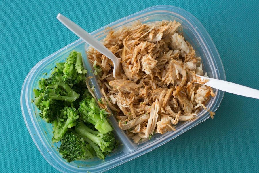 Meal Prep Recipes for Lunch Made with Chicken Close Up of a Container With Shredded Chicken on One Side and Broccoli on the Other