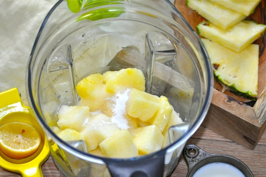 Make at Home Dole Whip Recipe a Blender Filled with Pineapple Chunks and Sugar