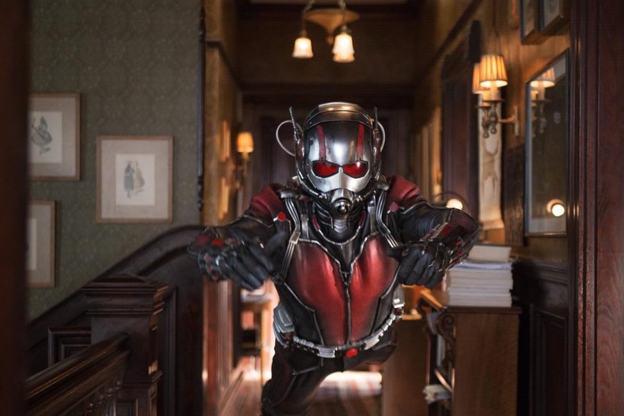 Marvel Movies in Order Ant-Man in Costume Jumping Forward Towards the Camera in a Hallway