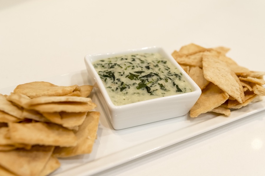 Slow Cooker Dips Close Up of a Serving Platter with Chips and Artichoke Dip