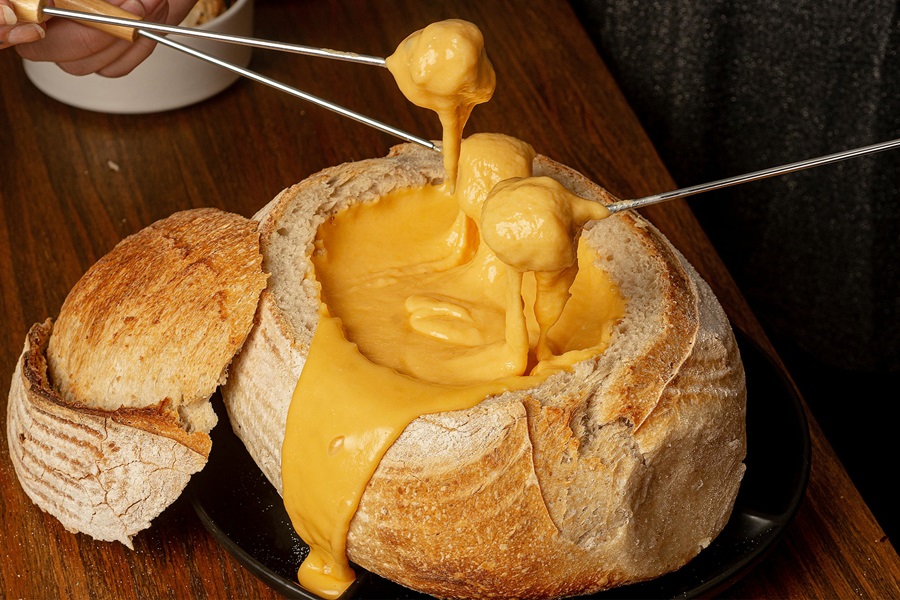 Slow Cooker Dips Close Up of a Bread Bowl Filled with Cheese Dip