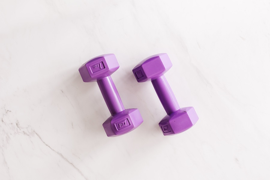 At Home Workout Equipment for Small Spaces Close Up of Two Purple Dumbbells