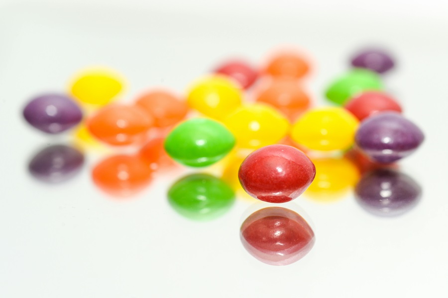 Awesome April Fool's Day Pranks to Play on your Husband Close Up of Skittles on a White Surface