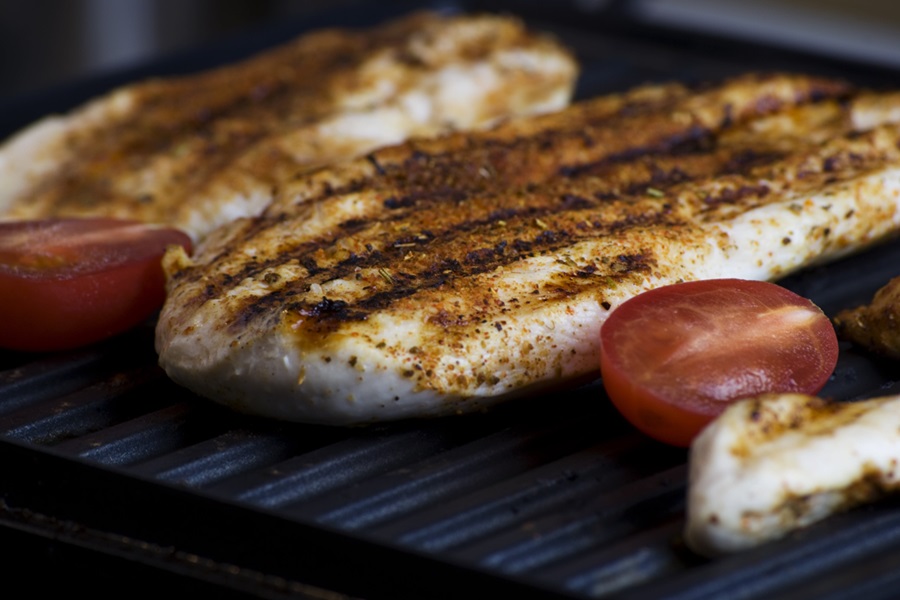 Intermittent Fasting 168 Foods to Eat Close Up of Chicken Breasts on a Grill with Tomatoes