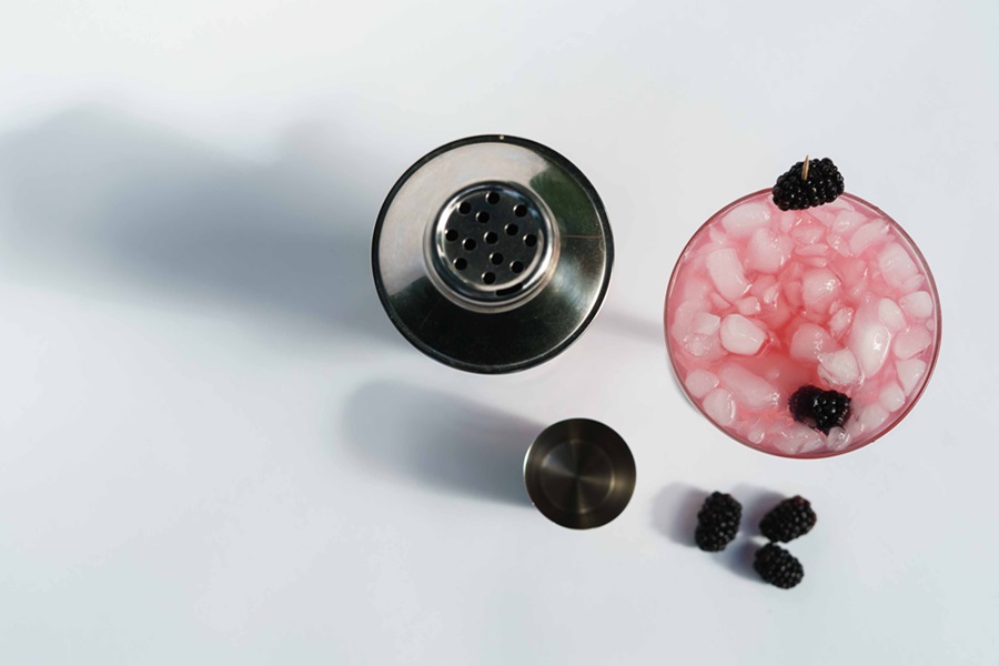 Margarita Recipes to Enjoy Overhead View of a Glass of Blackberry Margarita with Blackberries Scattered Around 