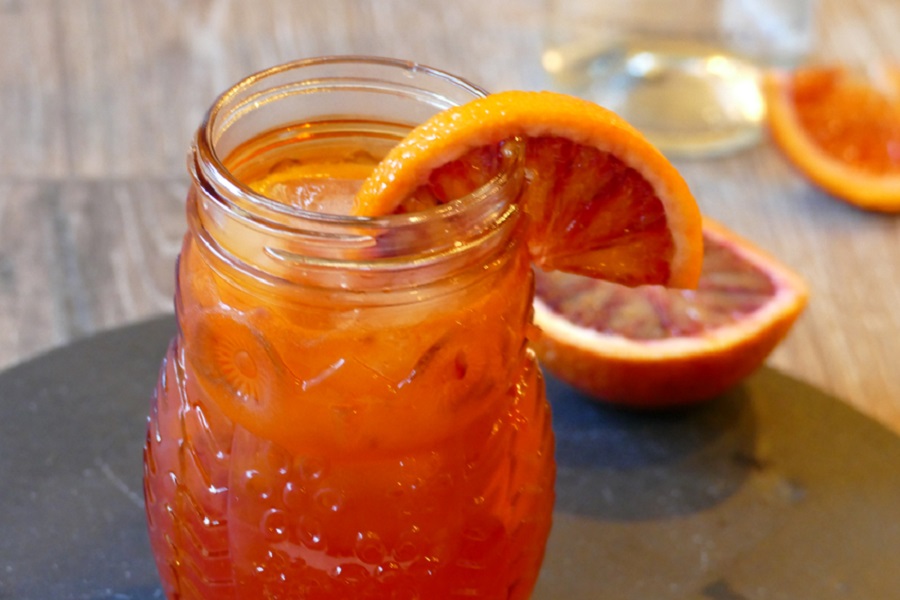 Margarita Recipes to Enjoy Close Up of a Citrus Margarita Garnished with a Blood Orange Wedge