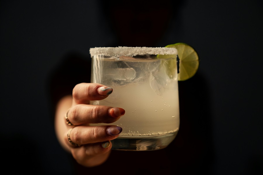Margarita Recipes to Enjoy a Person Reaching Out from The Dark Holding a White Margarita