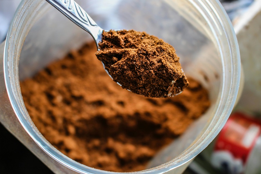 Beachbody Chocolate Shakeology Recipes a Spoonful of Chocolate Powder Over a Bowl of Chocolate Powder
