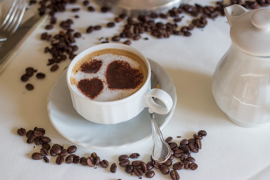 Low Carb Coffee Creamers a Cup of Coffee with Heart Shaped Foam Surrounded by Coffee Beans