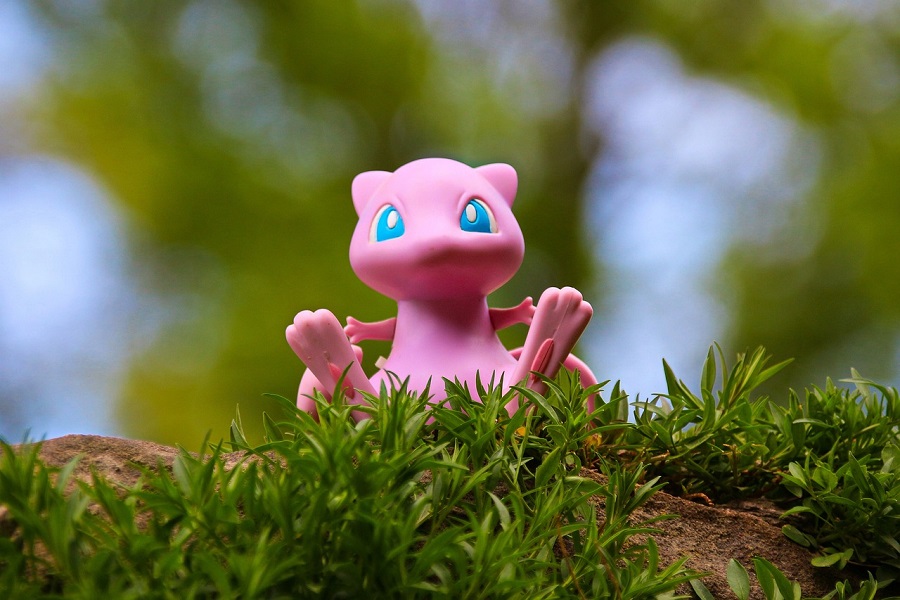 Pokemon Cake Ideas Close Up of a Small Mew Toy on Grass