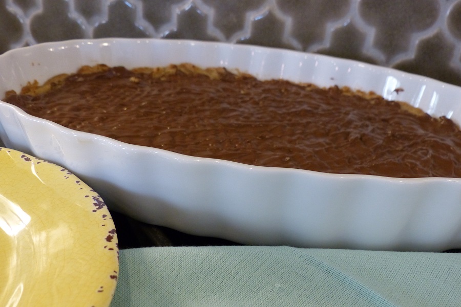 Super Soft Toffee Bars Recipe Angled View of a Casserole Dish with Toffee Inside Cooling