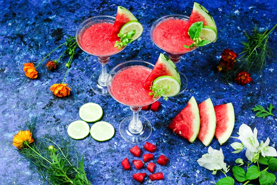 Fruity Margarita Recipes Three Watermelon Margaritas with Watermelon Wedges Scattered Around