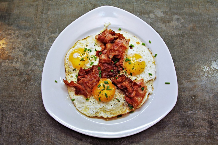 High Protein Low Carb Recipes for Breakfast a Plate of Sunny Side Up Eggs with Bacon Strips