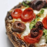 Easy Healthy Mushroom Pizza Recipe Close Up of a Portobello Mushroom Pizza with Pepperoni and Olives