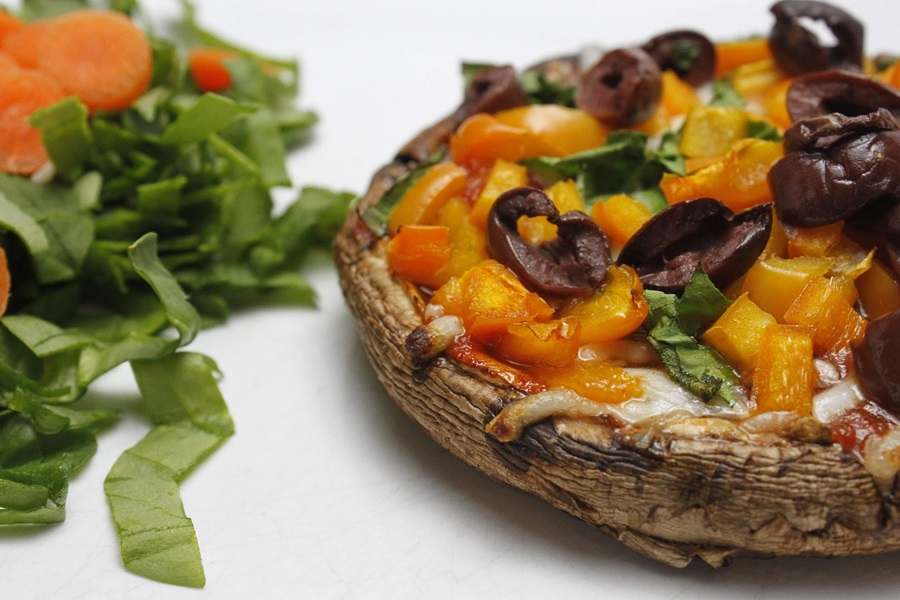 Easy Healthy Mushroom Pizza Recipe Close Up of a Portobello Mushroom Pizza with Diced Basil Next to it