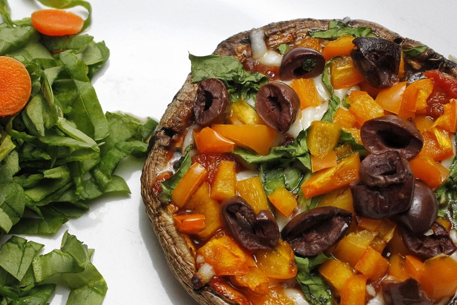 Easy Healthy Mushroom Pizza Recipe Close Up of a Portobello Mushroom Pizza with Diced Peppers and Olives