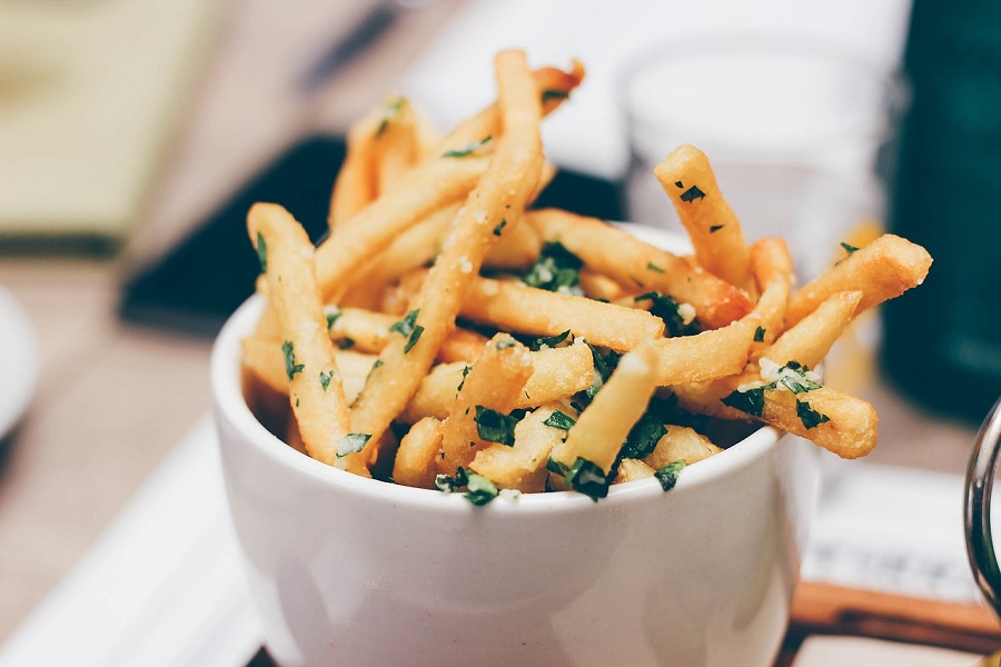 Low Sugar Snacks for a Low Carb Diet a Small Cup of French Fries with Parsley and Garlic