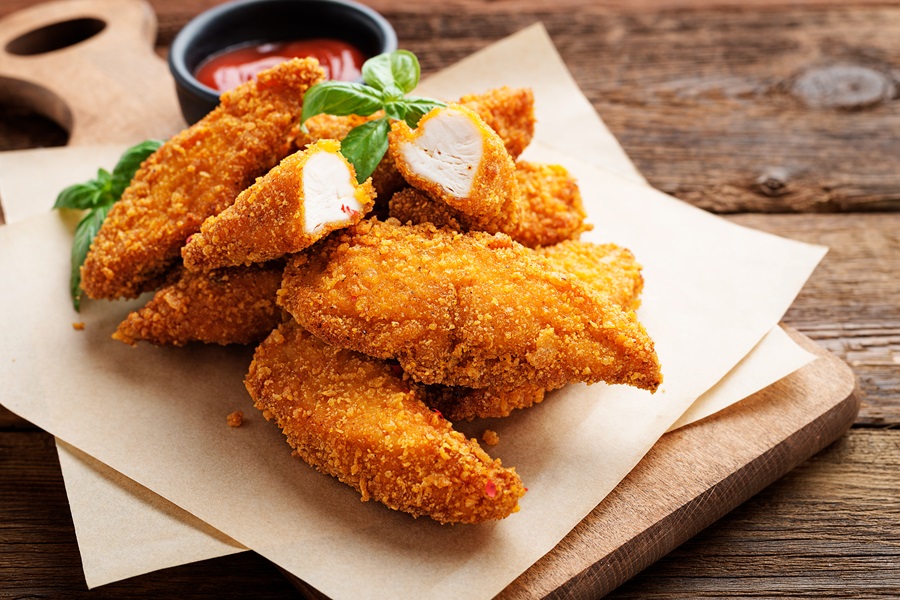 21 Tasty Ketogenic Chicken Strips Recipes Close Up of Chicken Strips with a Small Dish of Ketchup