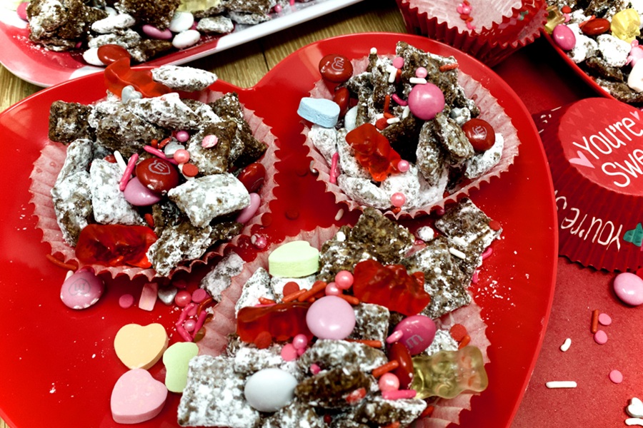 Valentines Puppy Chow Recipe Close Up of a Small Heart-Shaped Tray with Puppy Chow On Top