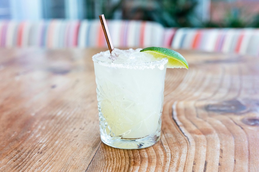 Best Winter Margarita Recipes for a Crowd Close Up of a Margarita with a Wedge of Lime