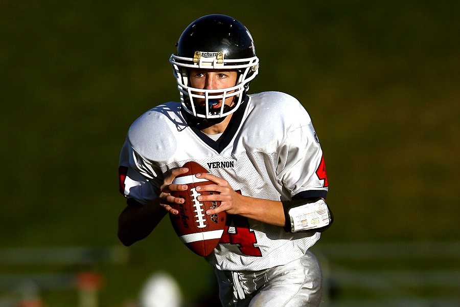 Super Bowl Party Close Up of a Quarter Back About to Throw The Ball