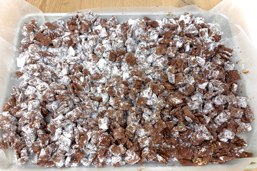 Valentines Puppy Chow Recipe Close Up of Chex Cereal Covered in Chocolate and Powdered Sugar