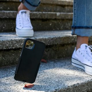 Otterbox Prefix vs Commuter Close Up of a Falling Phone in a Black Case