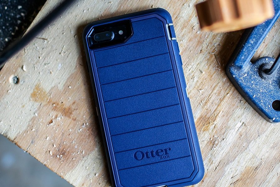 Otterbox Defender vs Commuter vs Symmetry Overhead View of a Phone in a Blue Otterbox Case