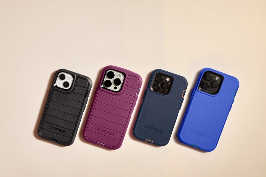 Otterbox Defender vs Commuter vs Symmetry a Line of Phones in Otterbox Cases on a Yellowish Background