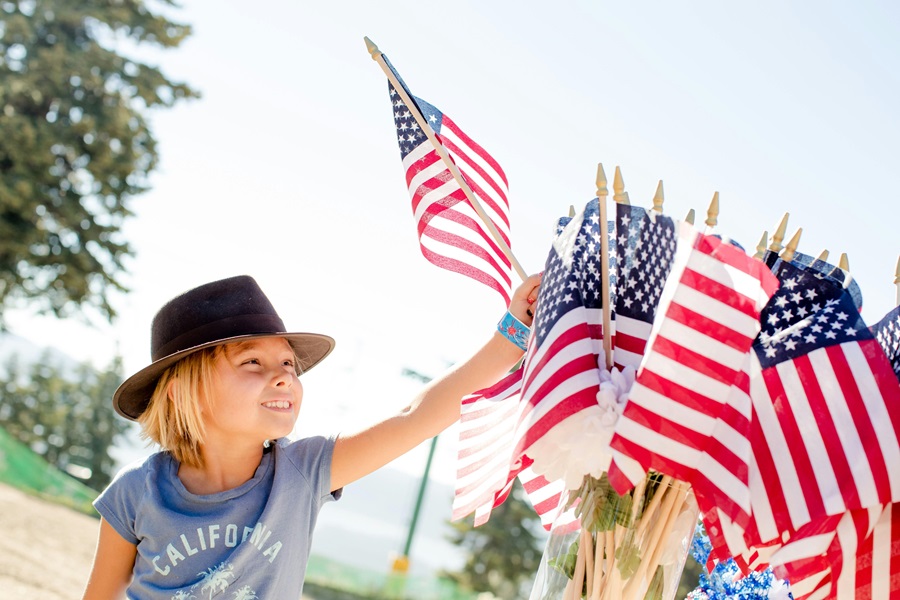 Easy 4th of July Recipes a Child Reaching for a Small American Flag Outside