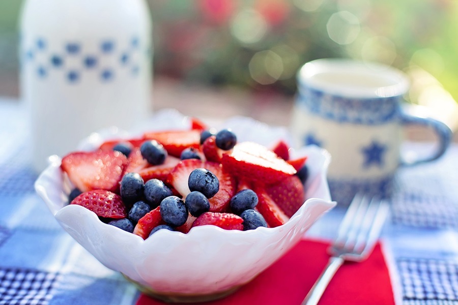 4th of July Party Ideas Close Up of a Bowl of Sliced Strawberries and Blueberries