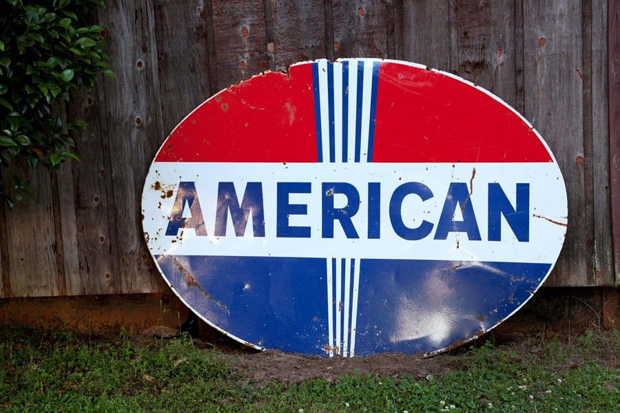 55 Patriotic Dessert Recipes a Sign That Says "American" Leaning Up Against a Wooden Fence