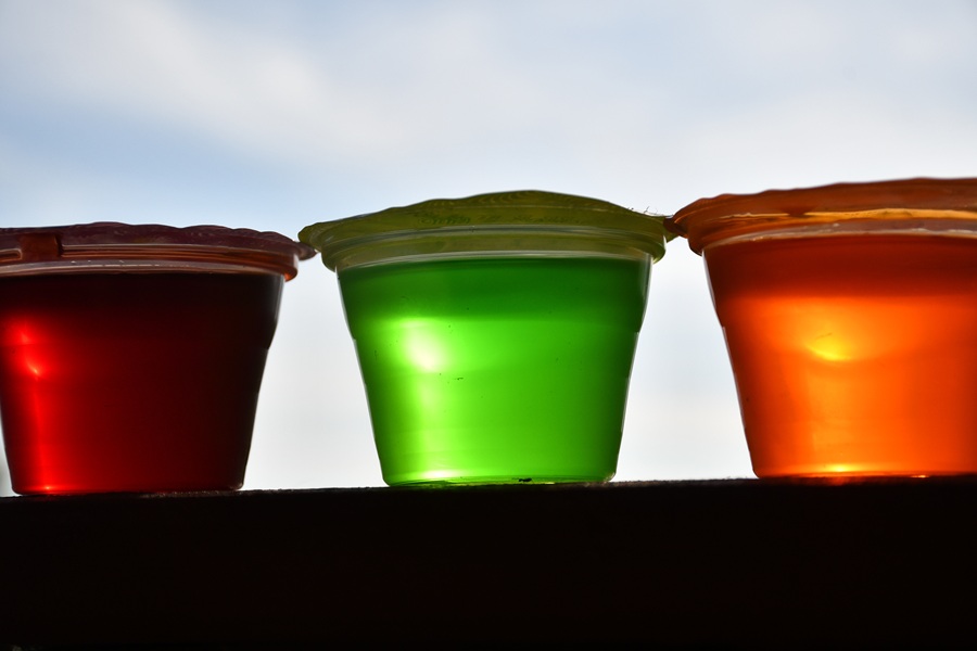 Easy Margarita Jello Shots for Margarita Lovers Close Up of Three Jello Shots One Red, One Green and One Orange