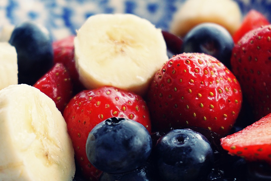 16/8 Intermittent Fasting Plan Tips Close Up of Berries Including Strawberries, Blueberries, and Banana