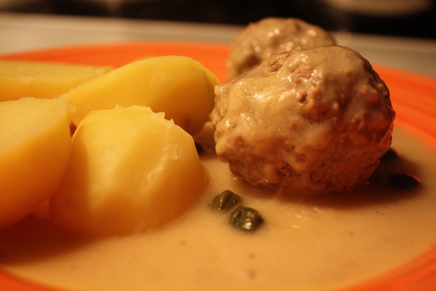 Low Carb Meatballs Recipe Ideas Close Up of Meatballs with Two Small Potato Pieces on a Plate
