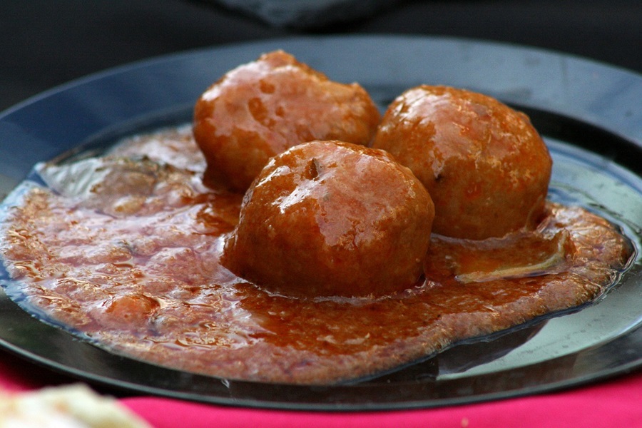 Low Carb Meatballs Recipe Ideas Close Up of Three Meatballs Covered in a Thick Tomato Sauce