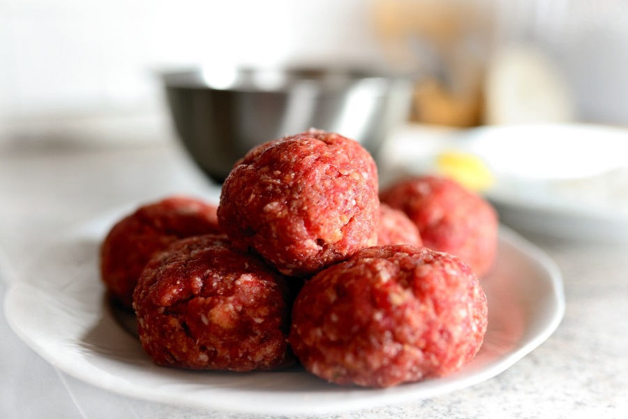 Low Carb Meatballs Recipe Ideas Close Up of Raw Meatballs on a Small White Plate
