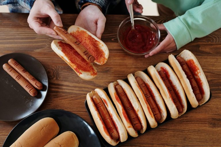 Crockpot Halloween Recipes a Family Putting Hot Dogs That Look Like Fingers in Hot Dog Buns