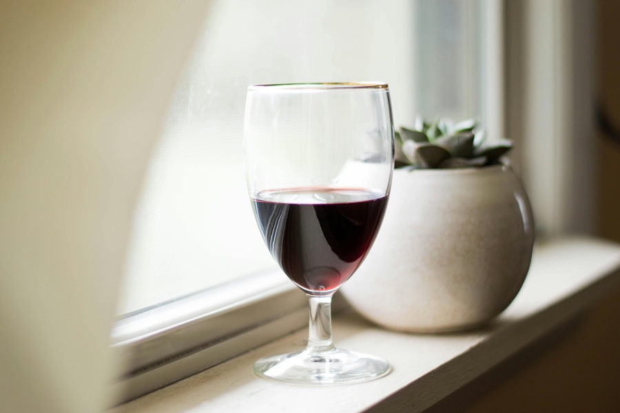 Fall Red Wine Sangria Recipes Close Up of a Glass of Red Wine on a Window Sill