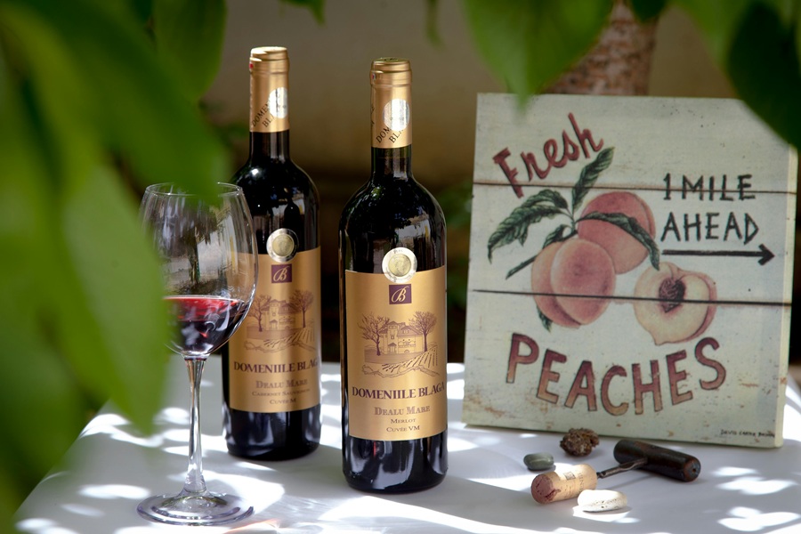 Fall Red Wine Sangria Recipes Two Bottles of Red Wine Next to a Wooden Sign That Says Peaches