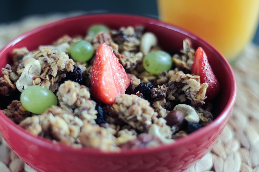 On the Go Keto Snacks Close Up of a Bowl of Granola and Strawberries