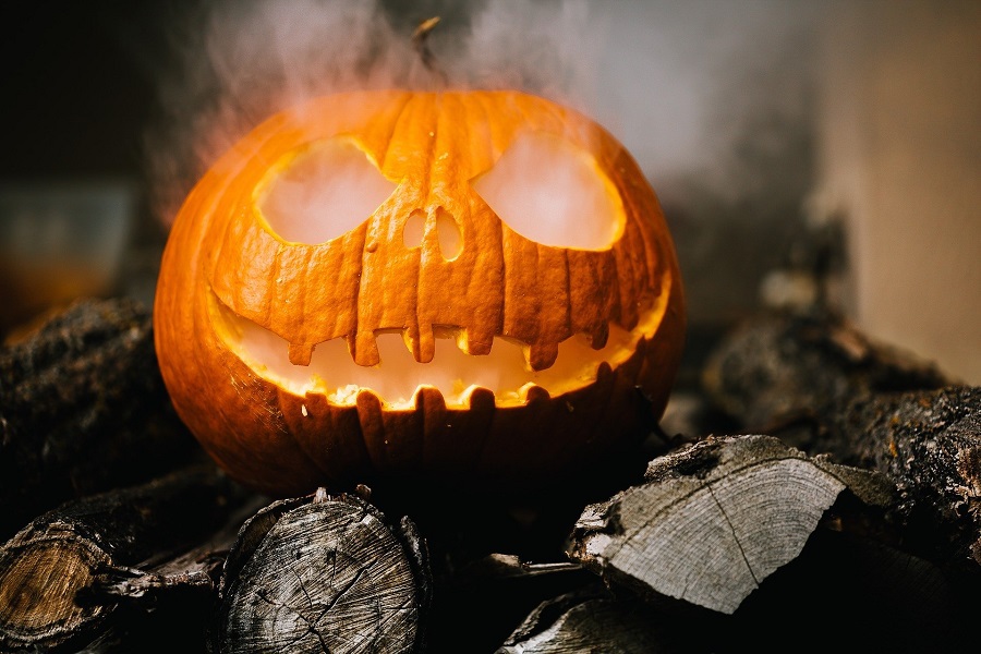 Crockpot Halloween Recipes for All Ages Carved Pumpkin with Smoke Coming from the Eyes