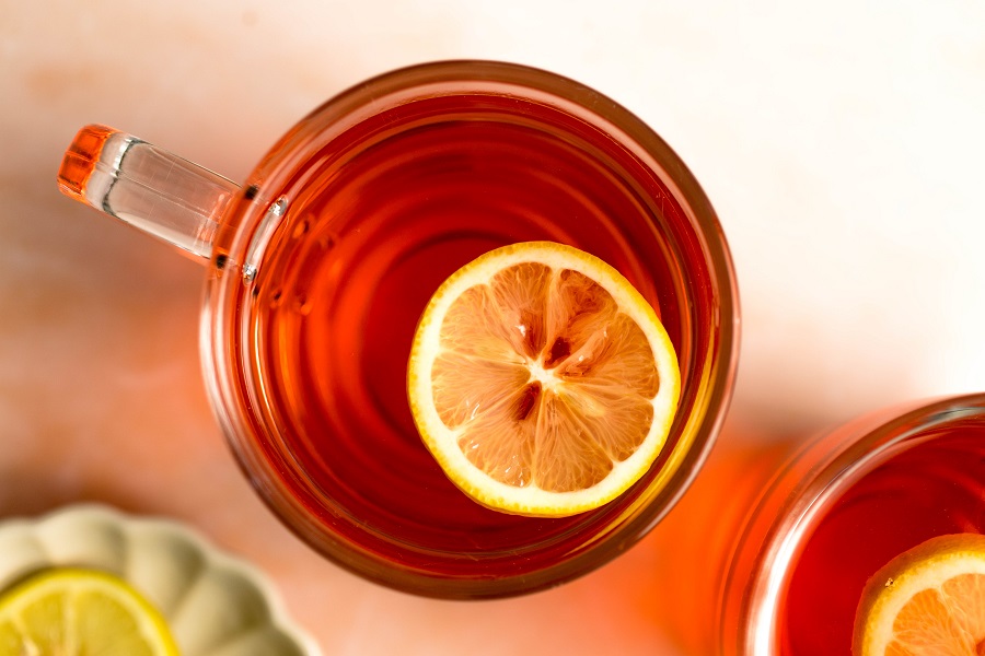 Jillian Michaels Detox Drink Recipe Overhead View of a Glass with Detox Drink and an Orange Slice