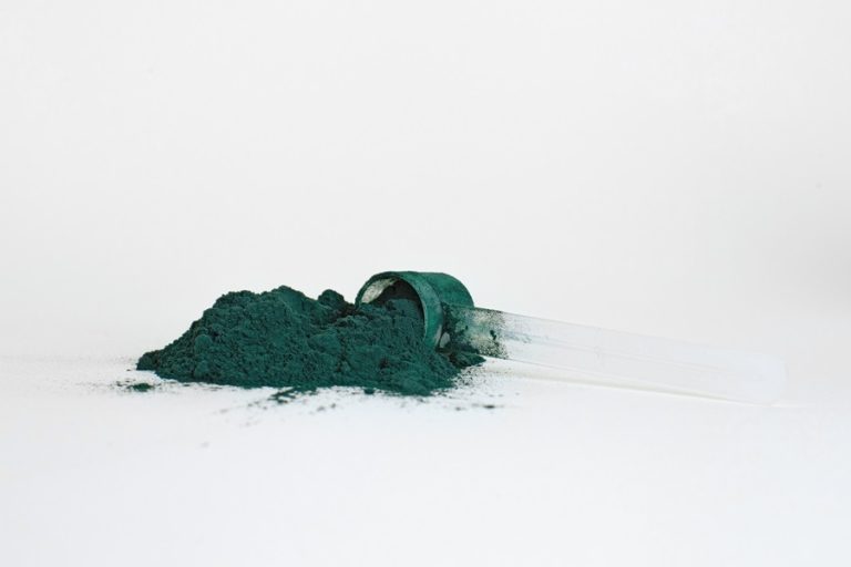 Best Protein Powder for Diabetics Close Up of a Powder Scoop Overflowing with Green Powder
