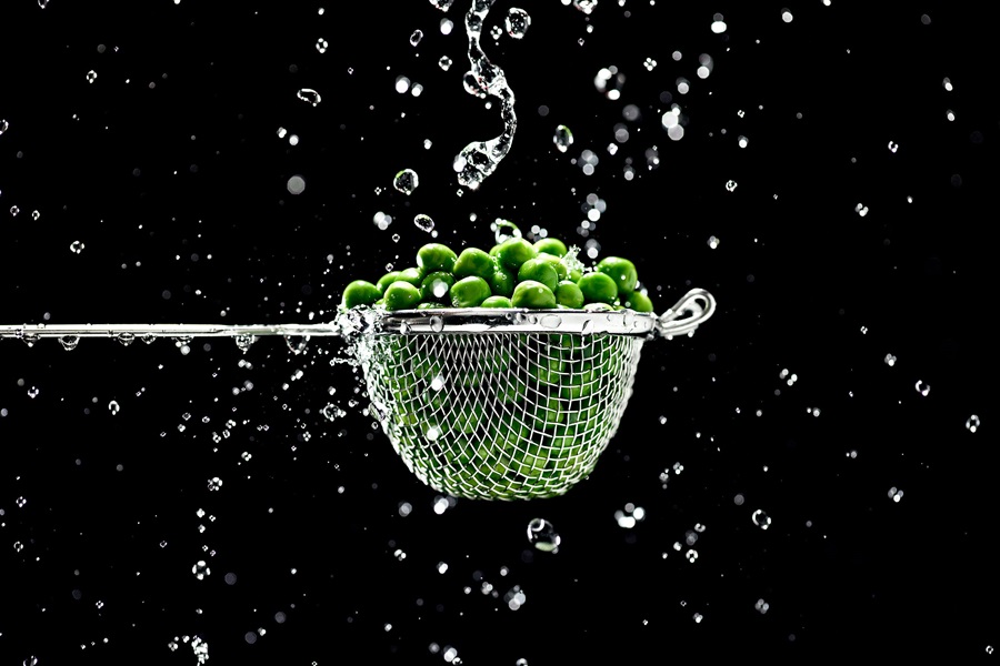 Best Protein Powder for Diabetics Close Up of a Basket of Peas Being Rinsed