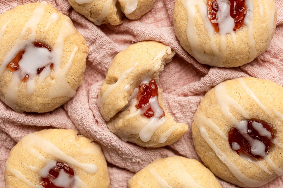 Thumbprint Cookies with Icing Recipe Close Up of Cookies with One Having a Bite Taken From It