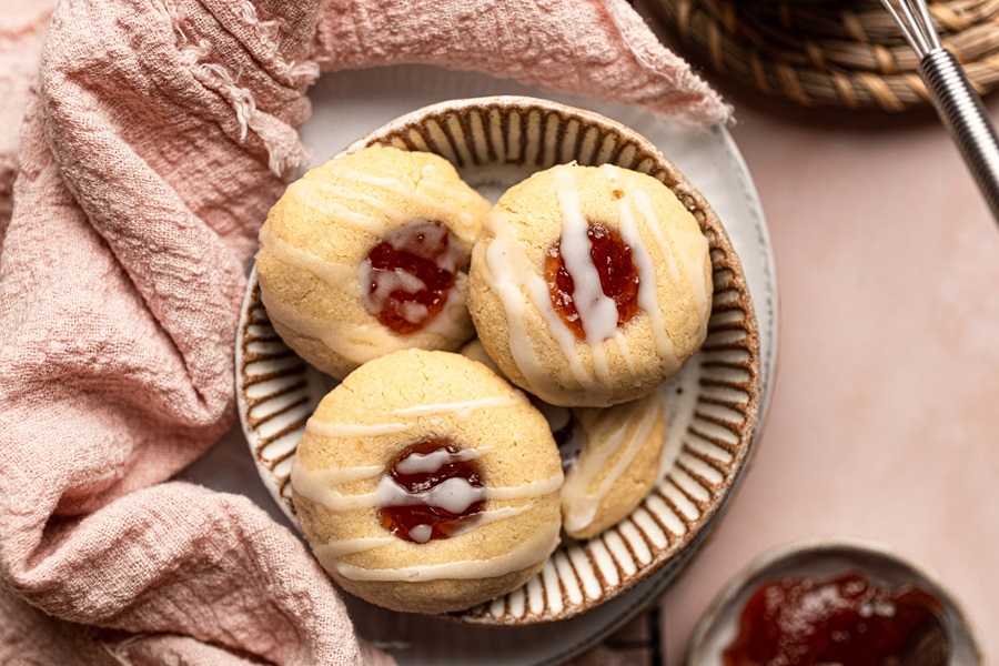 Thumbprint Cookies with Icing Recipe a Plate of Cookies on a Kitchen Towel